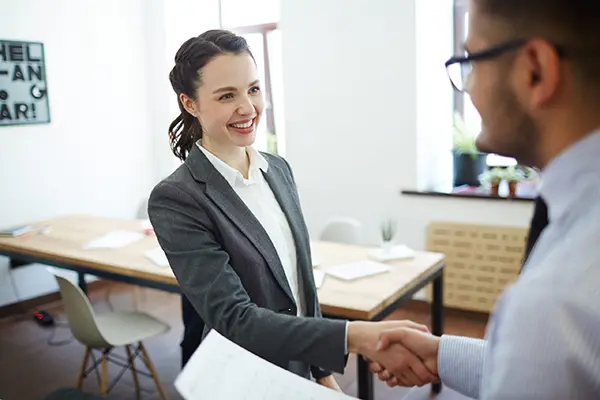 businesswoman-employee-shaking-hands-scaled copy